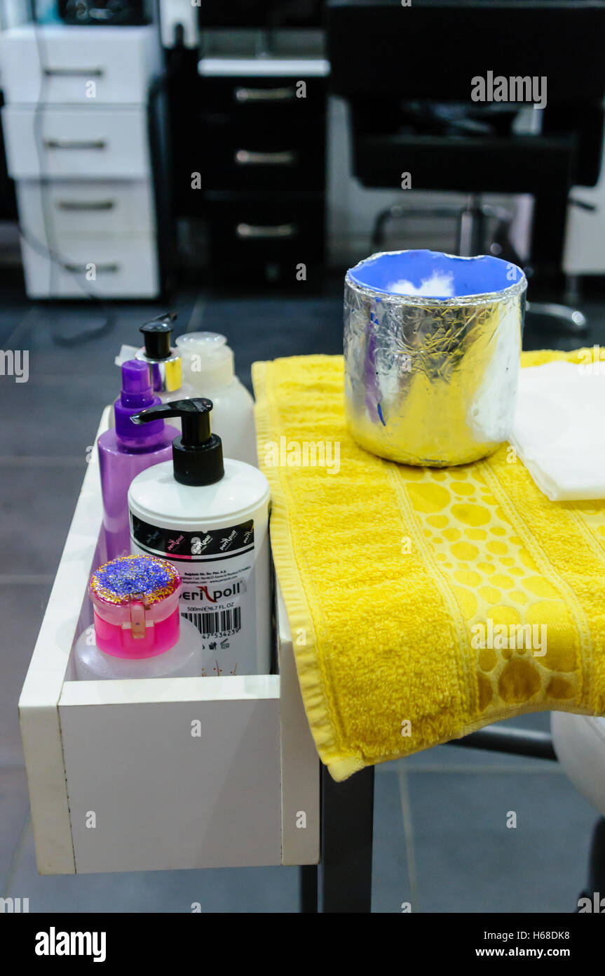 Bottles of nail products in a beauty salon. Stock Photo