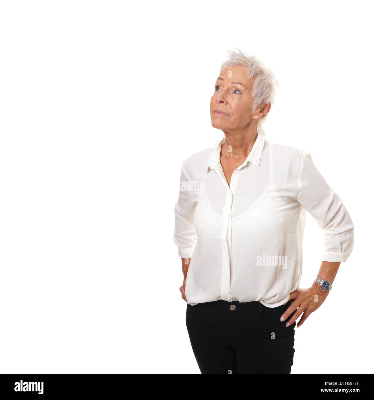older woman looking up at copy space Stock Photo
