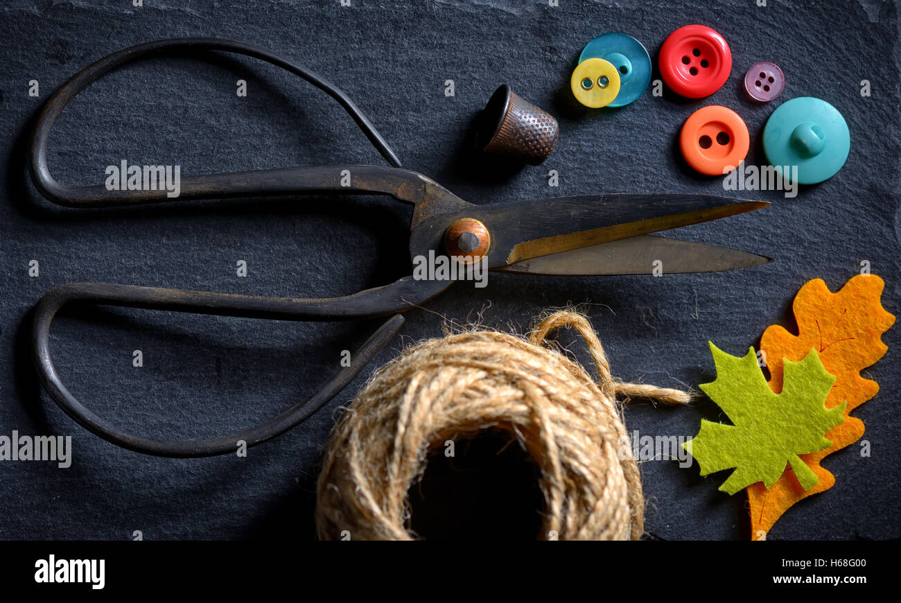 vintage scissors with a roll of twine and buttons Stock Photo