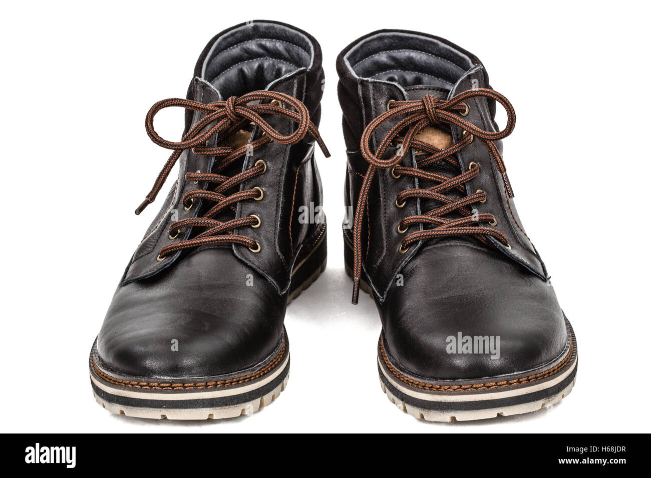 Pair of new boots, isolated on white background Stock Photo - Alamy