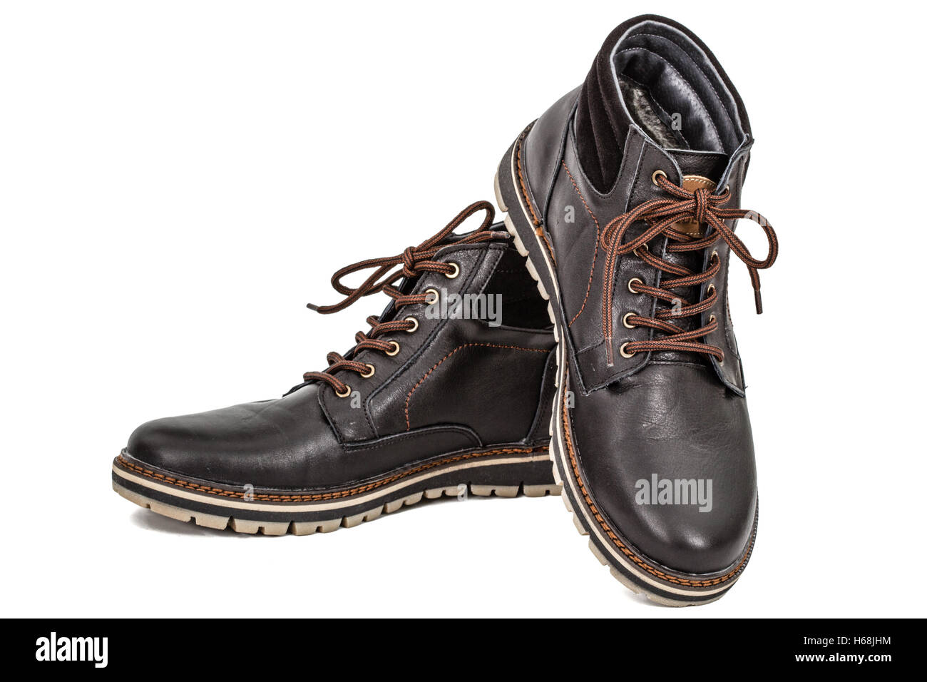 Pair of new boots, isolated on white background Stock Photo - Alamy