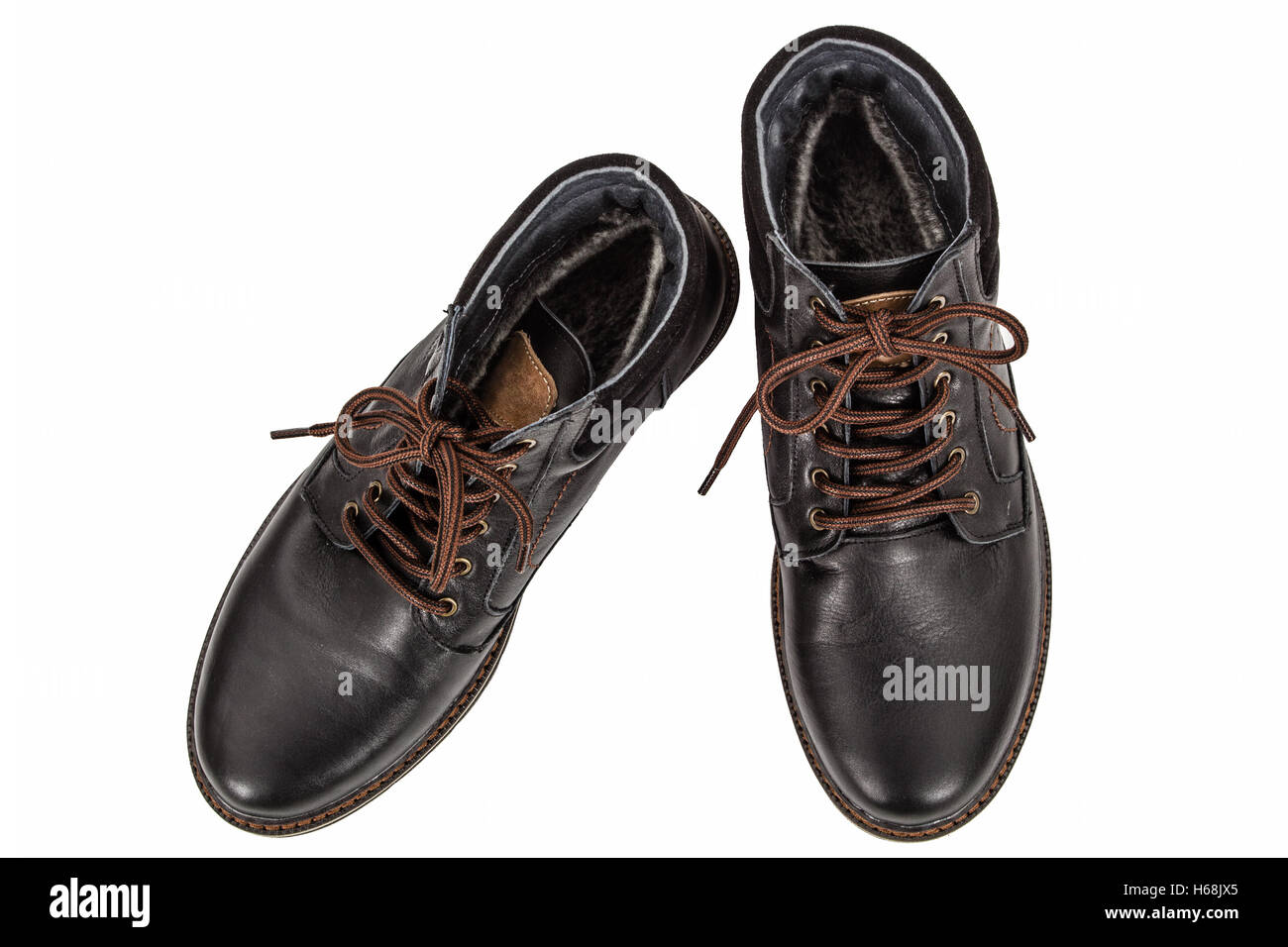 Pair of new boots, isolated on white background Stock Photo - Alamy