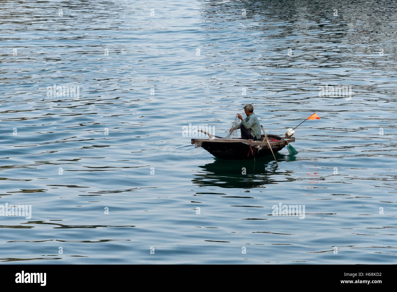 Fisherman in Ha Long Bay Stock Photo