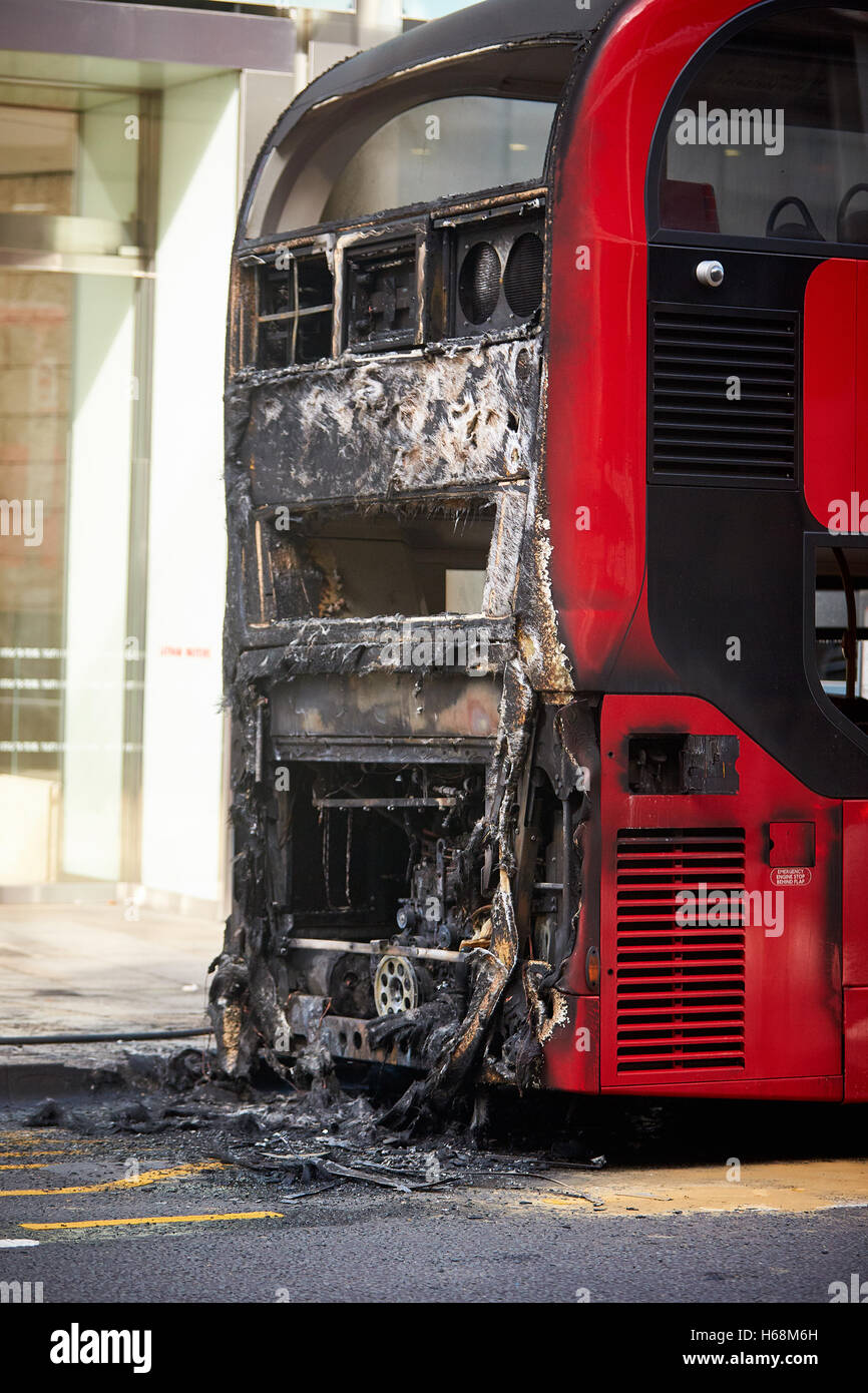 A fire-damaged bus in Bishopsgate, London Stock Photo - Alamy
