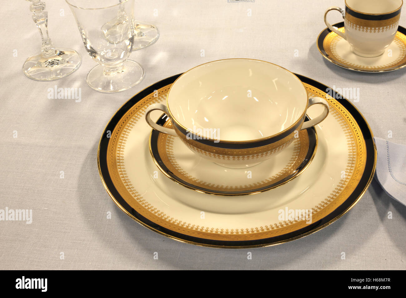 Elegant dish with cup of fine ceramics on the table of the restaurant Stock Photo