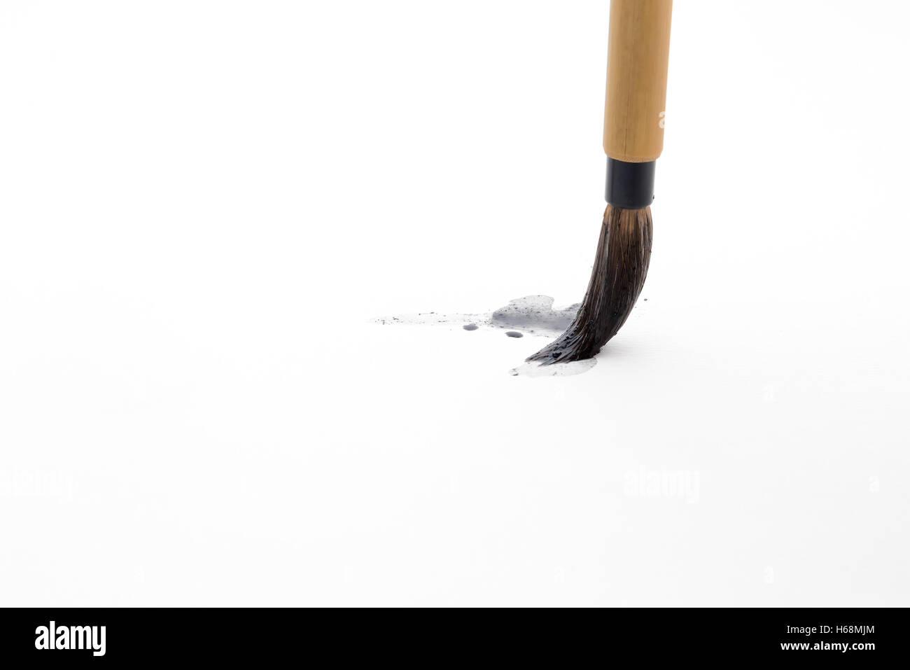 Chinese brushes on white papers Stock Photo Alamy