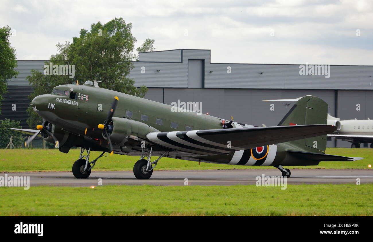 Douglas C-47A Skytrain, military version of the DC-3 Dakota,in USAAF D-Day markings at Biggin Hill Air Show, Bromley, UK Stock Photo