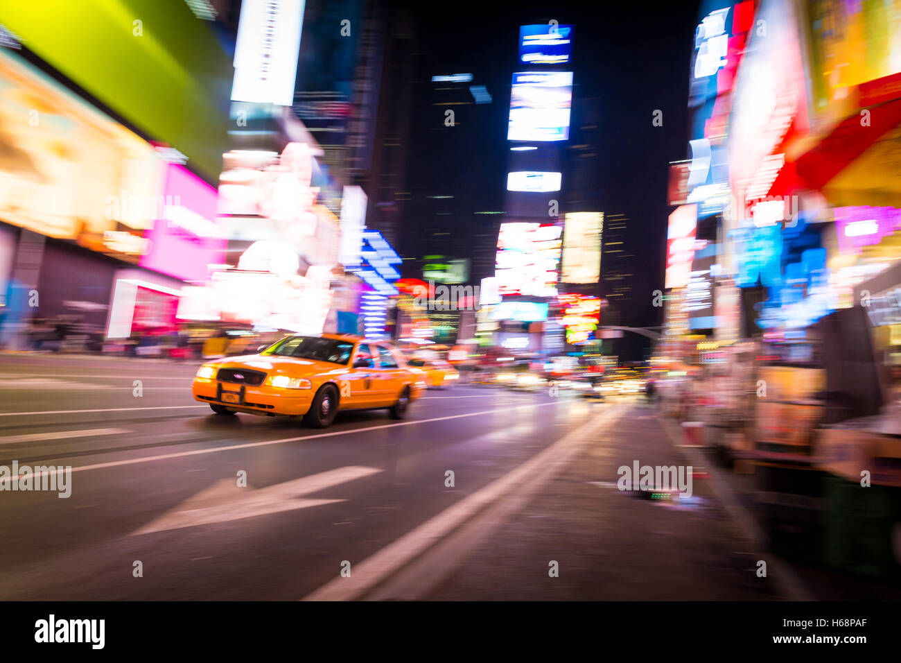 New York City NYC Taxi in motion in Times Square Stock Photo