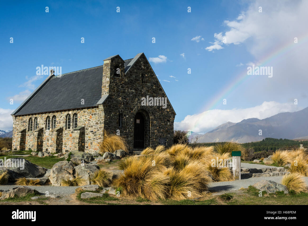 New Zealand Lake Tekape Church of the Good Shepperd with Rainbow - South Island Stock Photo