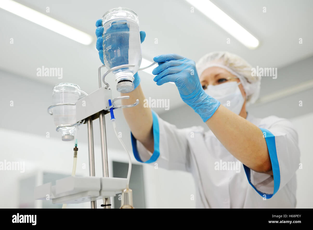 Doctor putting a drip to a patient Stock Photo Alamy