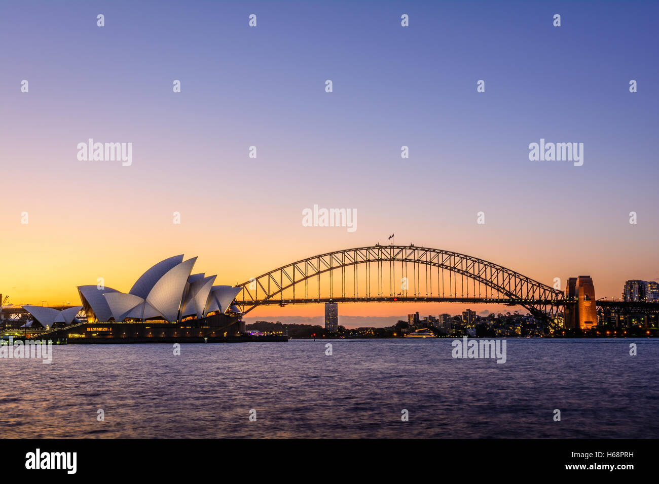 Sidney Bay Color Sunset with Opera House and Bridge, Australia Stock Photo