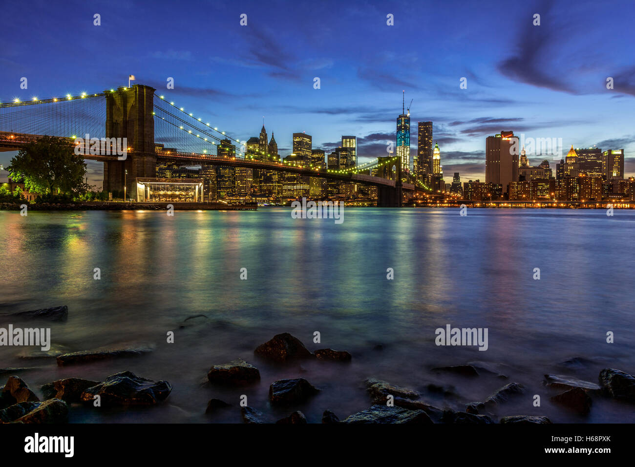 New York, Manhattan and Brooklyn Bridge Skyline Sunset / Night Landscape, USA Stock Photo