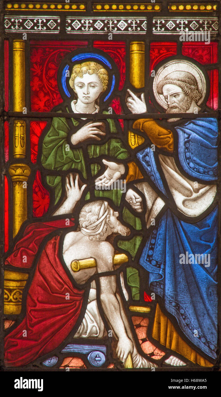 ROME, ITALY - MARCH 9. 2016: The Saints Peter and John Healing the Lame Man on the stained glass of All Saints' Anglican Church Stock Photo