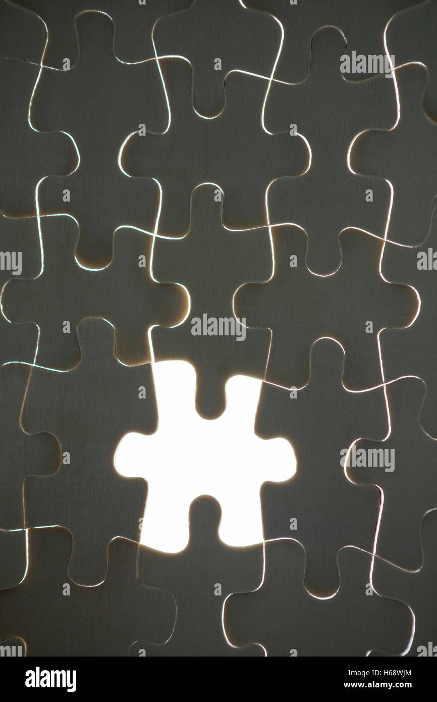 One piece of puzzle missing from jigsaw Stock Photo