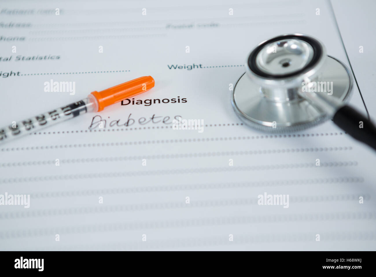 Close-up of injection with diabetes diagnosis and stethoscope Stock Photo