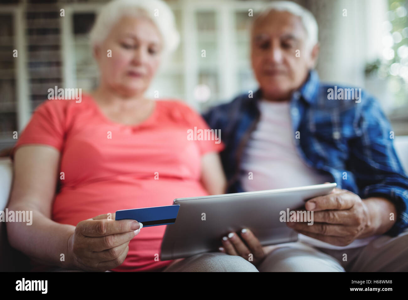 Senior couple doing online shopping on digital tablet Stock Photo