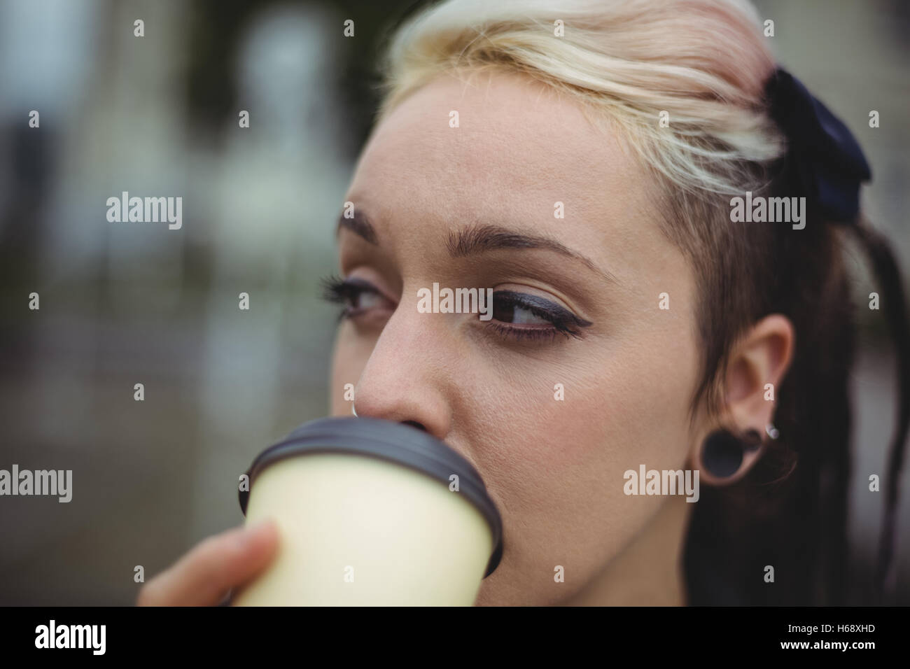 Close-up of businesswoman having coffee Stock Photo