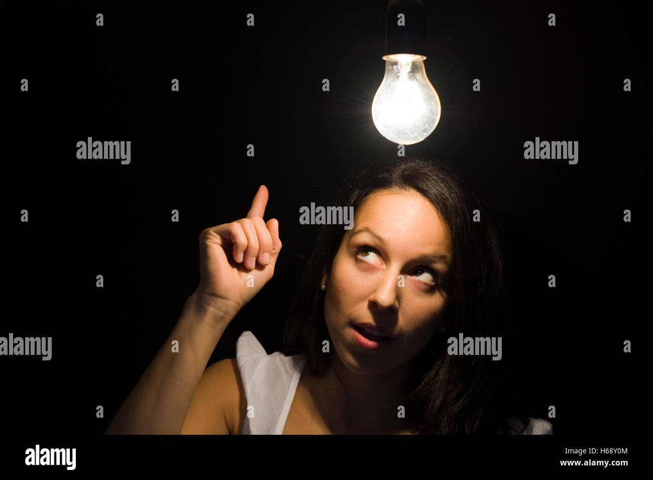 Woman, light bulb, symbolic image for enlightenment Stock Photo
