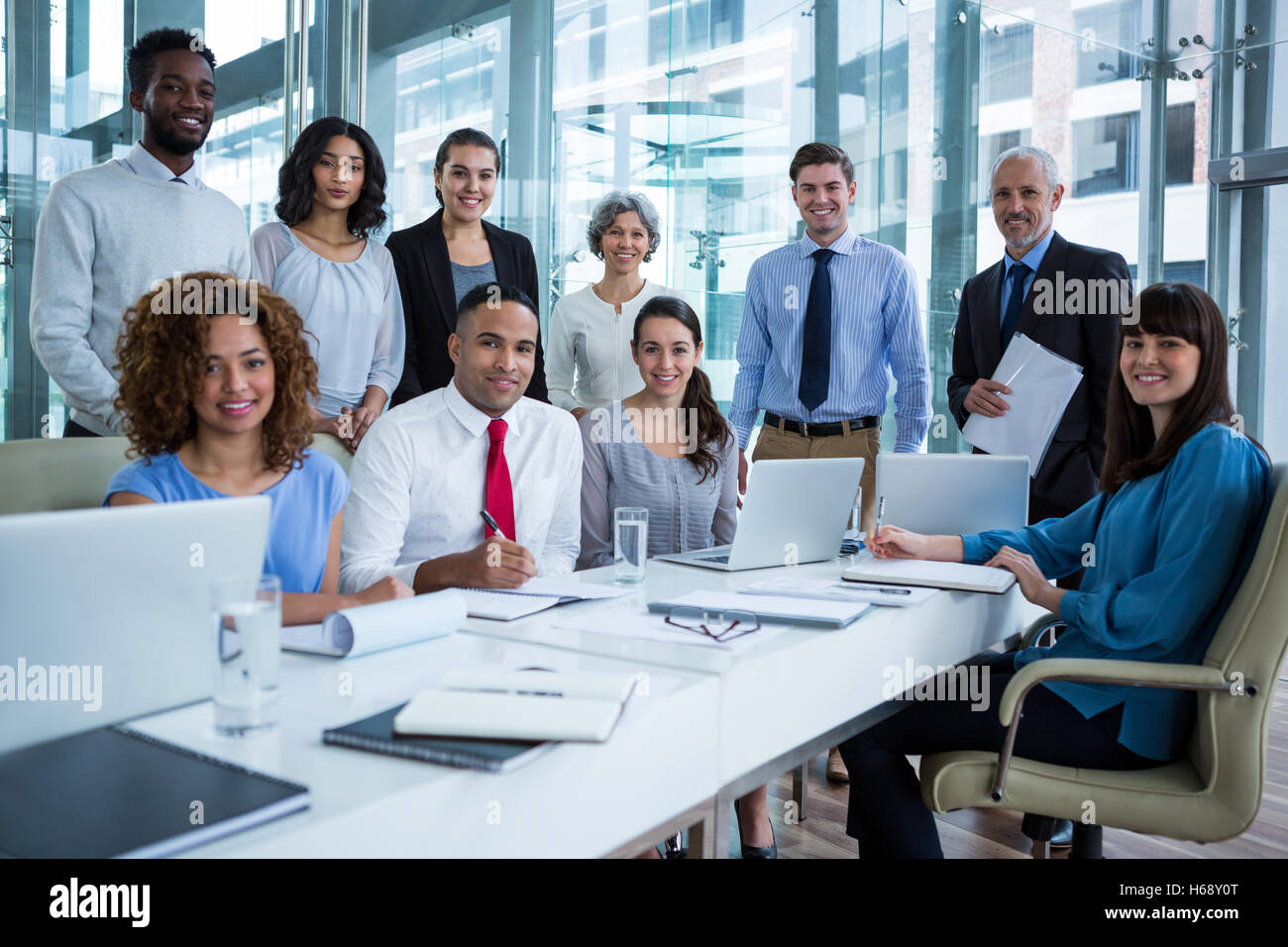 Smiling business people in office Stock Photo