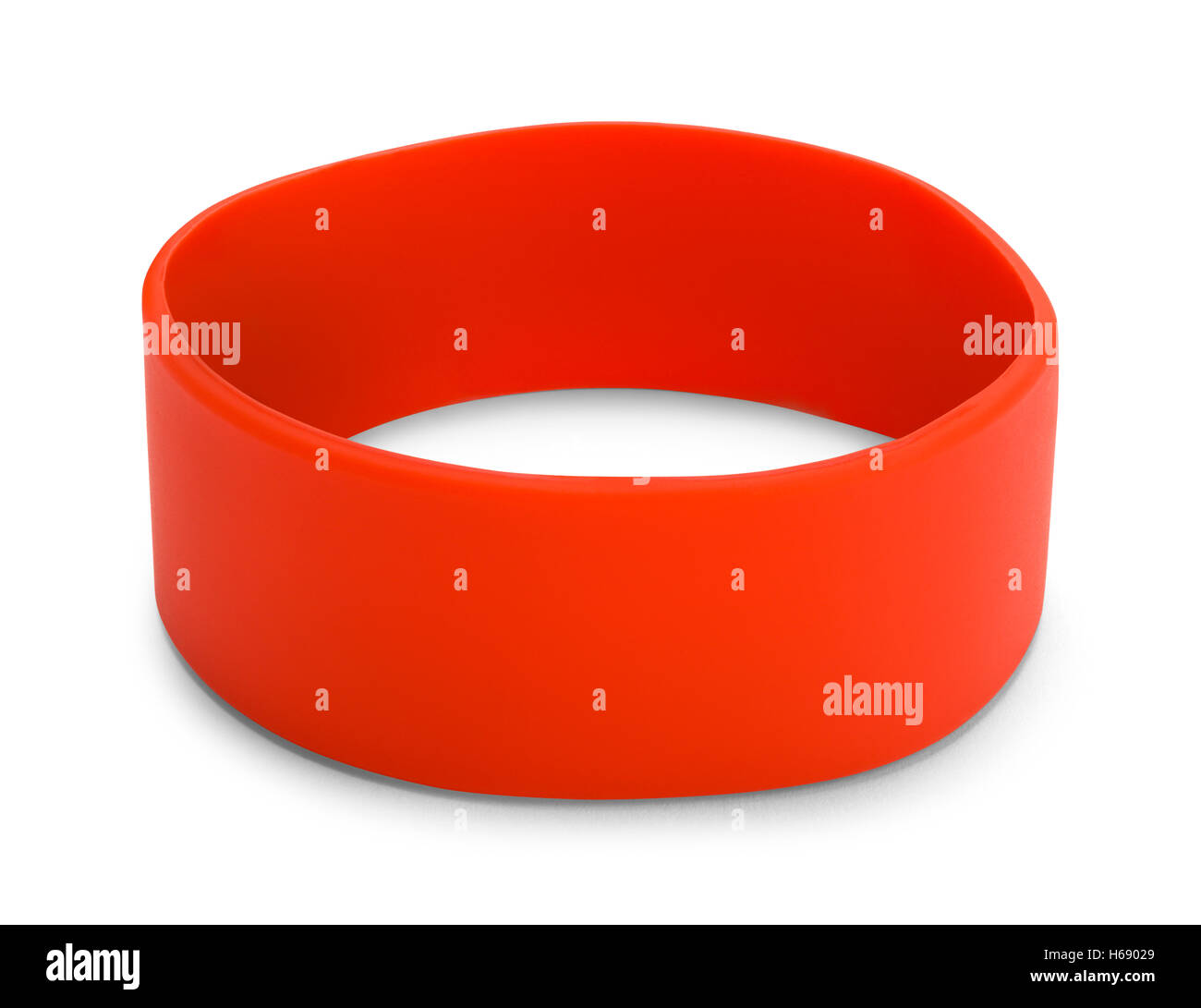 Large Red Rubber Bracelet with Copy Space Isolated on White Background. Stock Photo