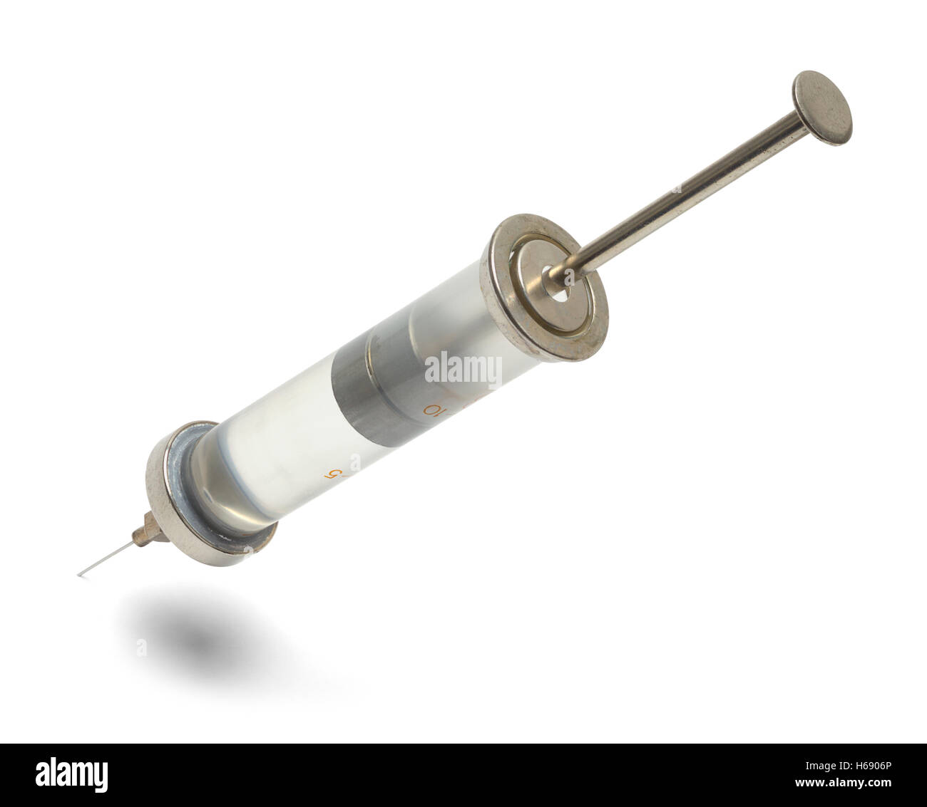 Stuck Vintage Glass Syringe and Needle Isolated on White Background
