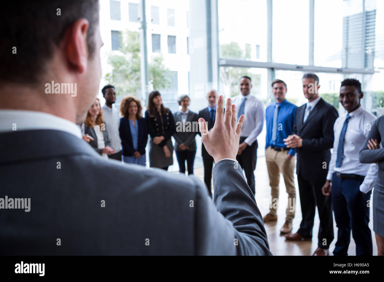 Businessman interacting with colleagues Stock Photo
