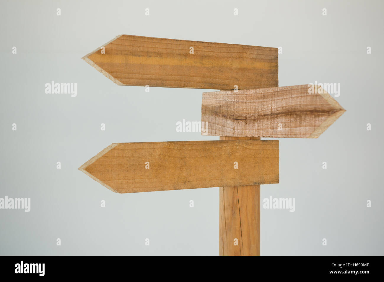 Wooden arrow direction sign post Stock Photo