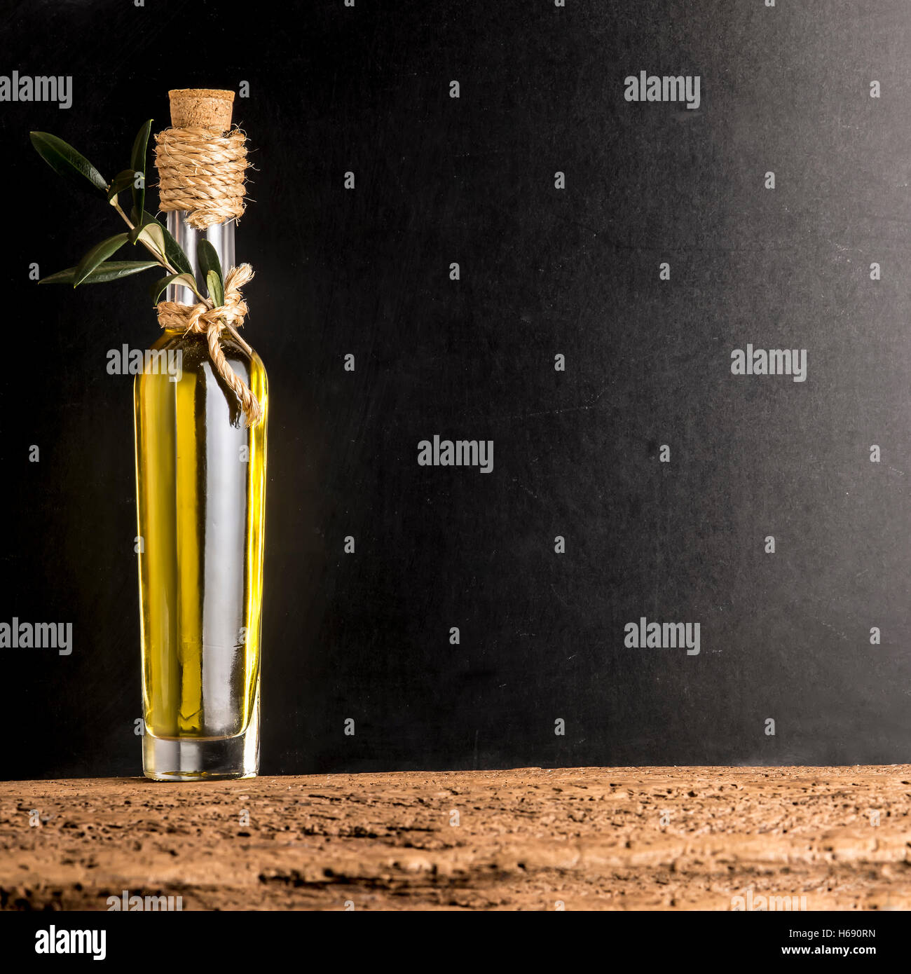 Extra Virgin Olive Oil In Rustic Glass Bottle On Rustic Background Stock Photo Alamy