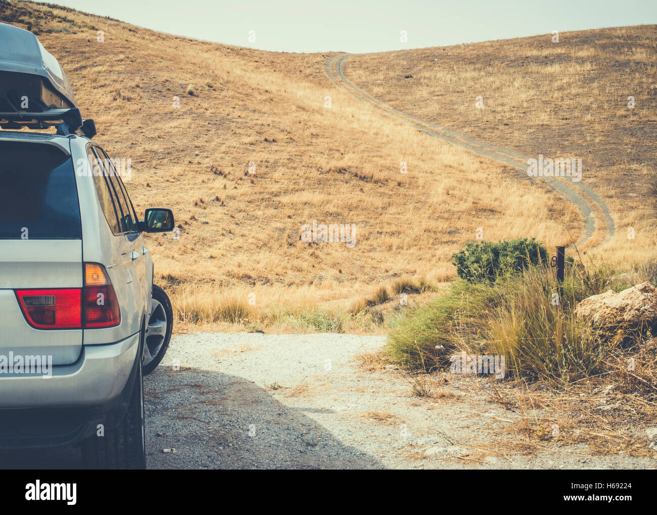 Tourist car and vintage dirt road Stock Photo