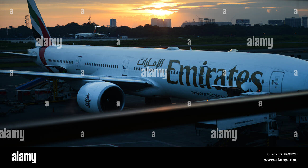 An Emirates airplane in Ninoy Aquino international airport in Manila. Stock Photo