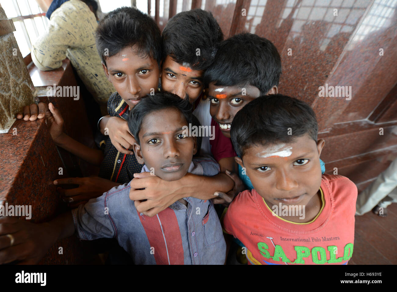 Tamil children posing for a photo on top of the Rockfort temple in Tiruchirappalli, India. Stock Photo