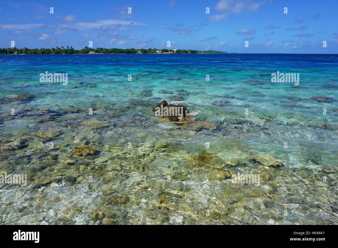 The Tiputa channel with its village on the other side, atoll of Rangiroa, Tuamotu archipelago, French Polynesia, Pacific ocean Stock Photo