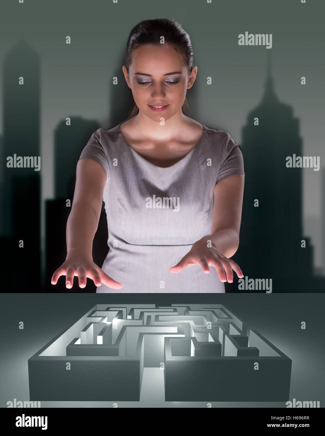Businesswoman with maze in difficult situations concept Stock Photo - Alamy