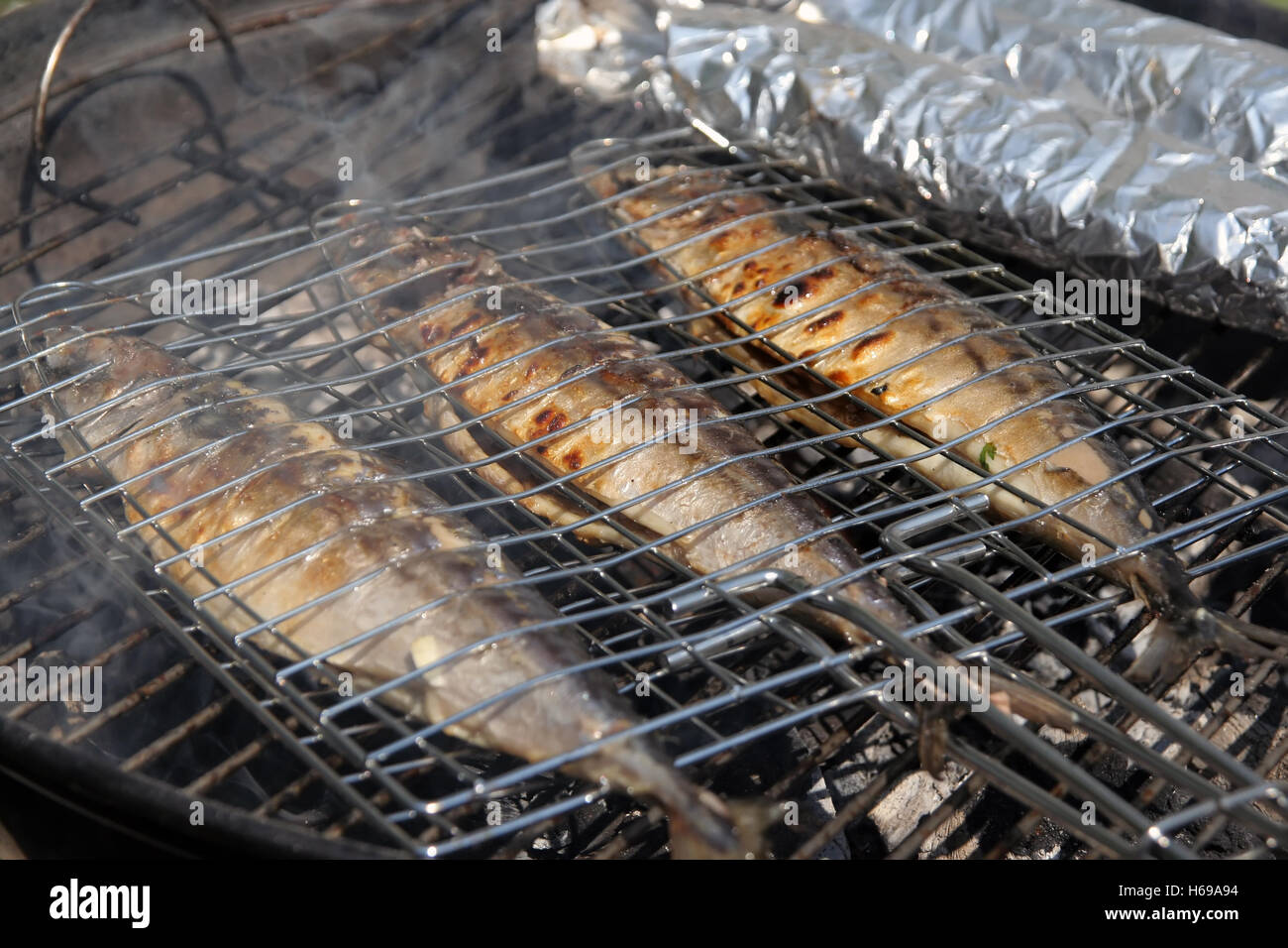 Fish on a grill. Fish on a barbecue. Stock Photo