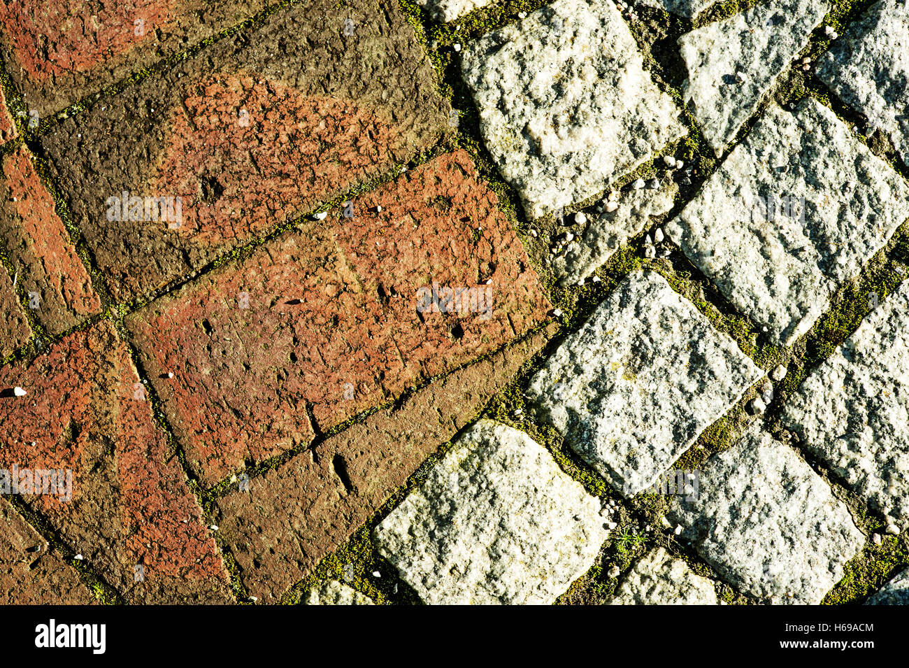 Close Up Abstract of Brick and Stone Block Paving Walkway or Pavement Looking Down Stock Photo