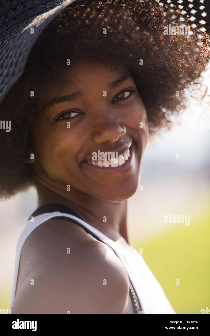 Close up portrait of a beautiful young african american woman smiling ...