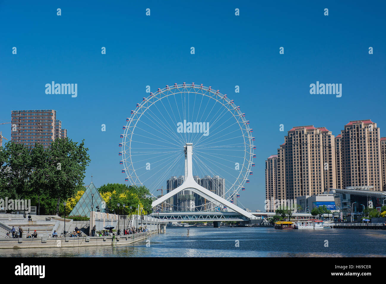 Tianjin,China - May 3,2016 : Cityscape of Tianjin ferris wheel,Tianjin eye in daytime. Tianjin eye is the most popular modern la Stock Photo