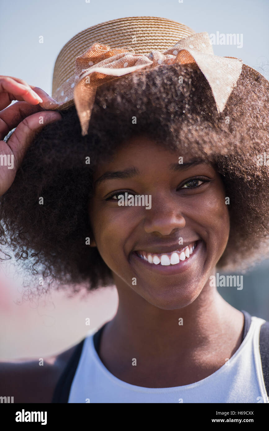 Close up portrait of a beautiful young african american woman smiling ...