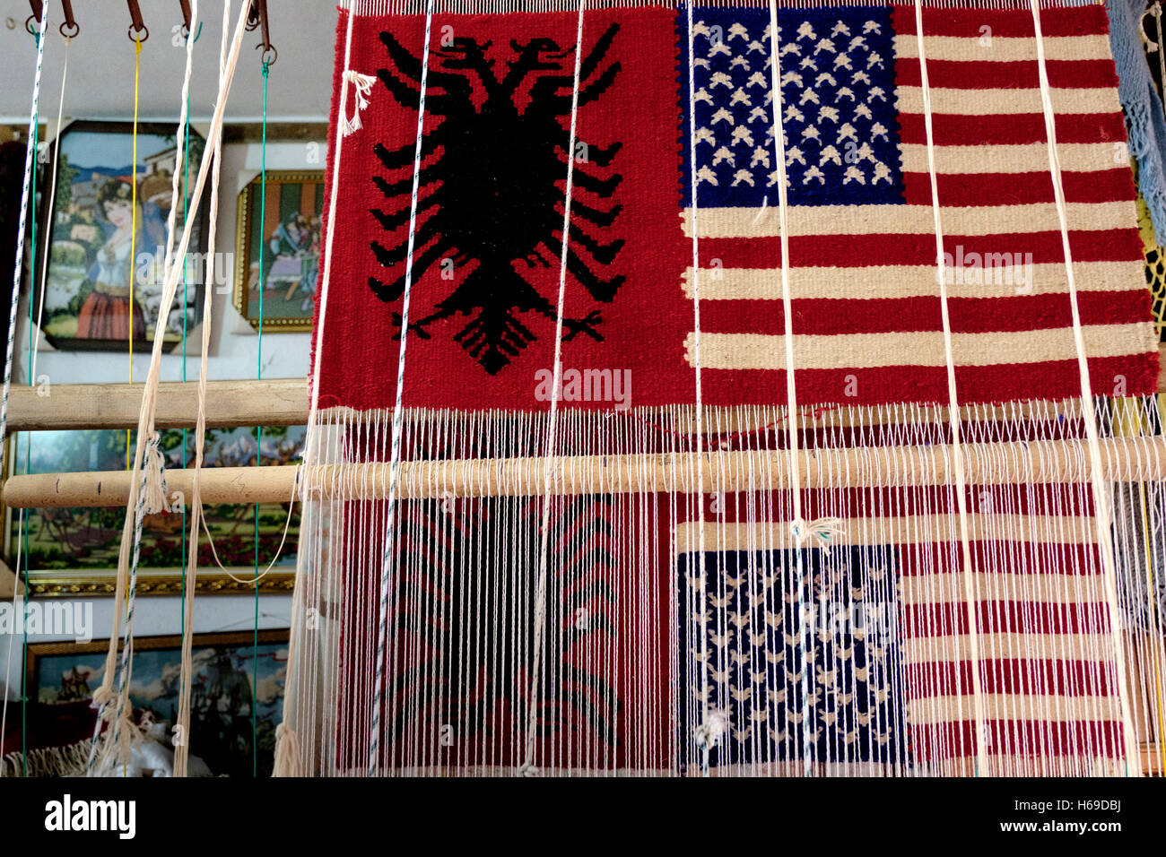 Weavings of the Albanian flag paired with the flags of other countries, such as an American flag, are popular souvenirs at the m Stock Photo