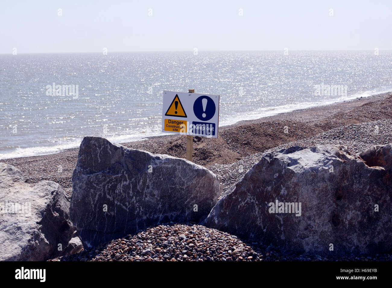 SAFETY WARNING SIGNS DURING BEACH REINFORCEMENT AT ALDEBURGH SUFFOLK. UK. Stock Photo