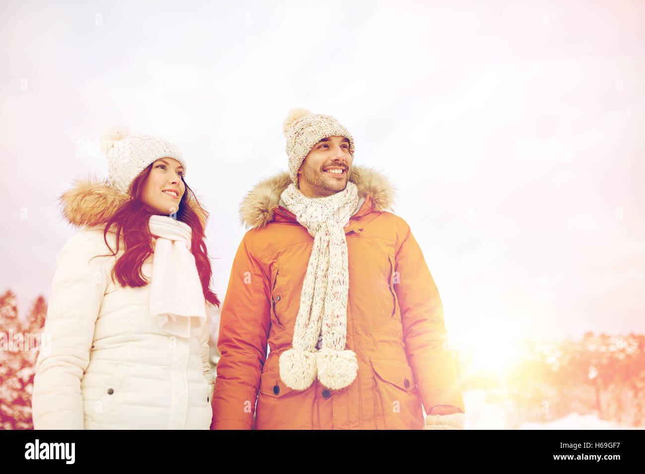 happy couple walking over winter background Stock Photo - Alamy