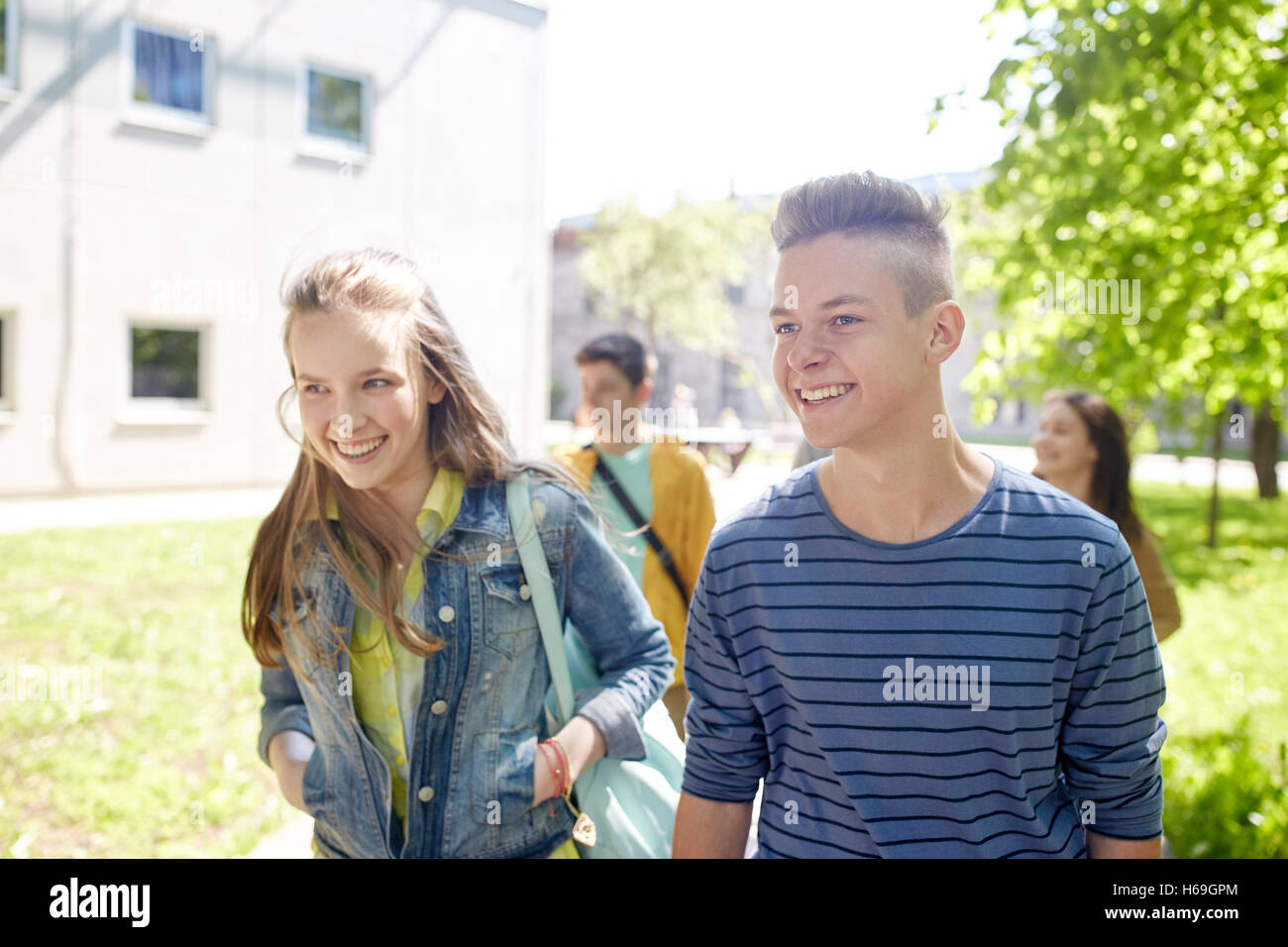 group of happy teenage students walking outdoors Stock Photo - Alamy