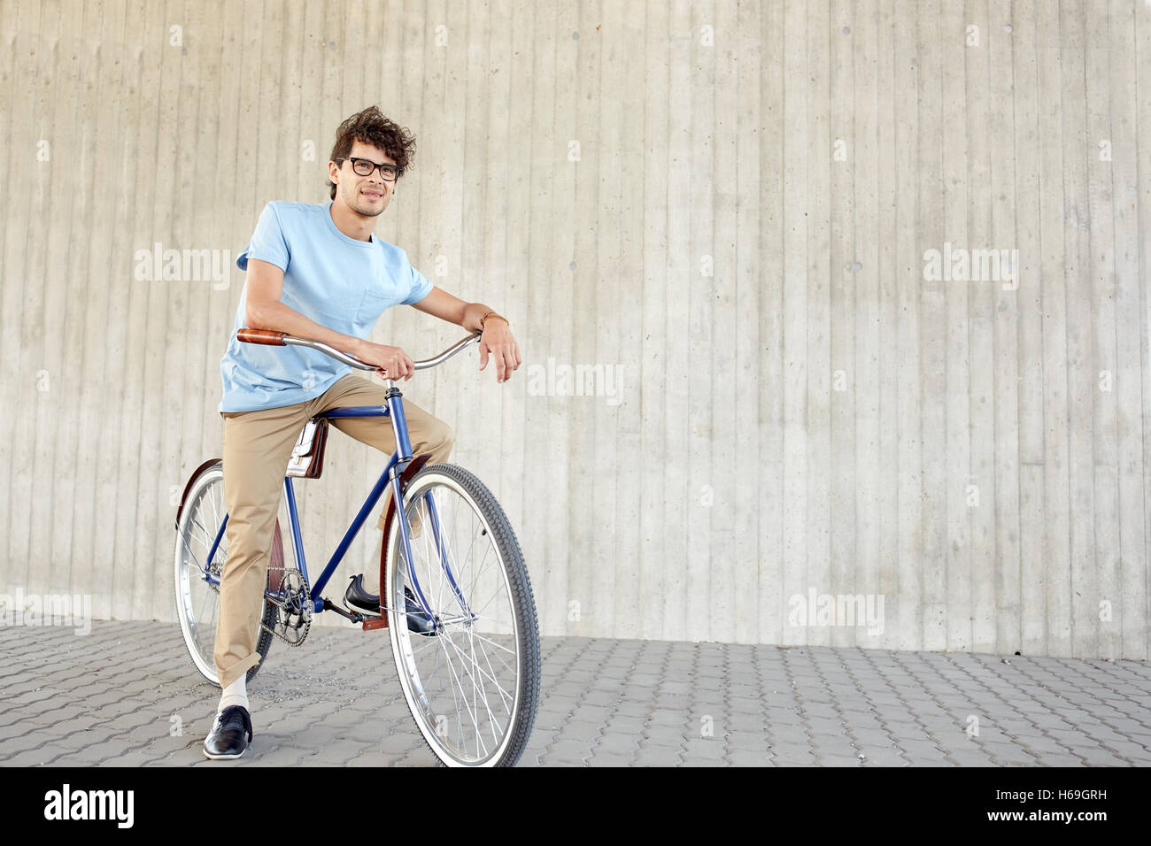 young hipster man riding fixed gear bike Stock Photo Alamy