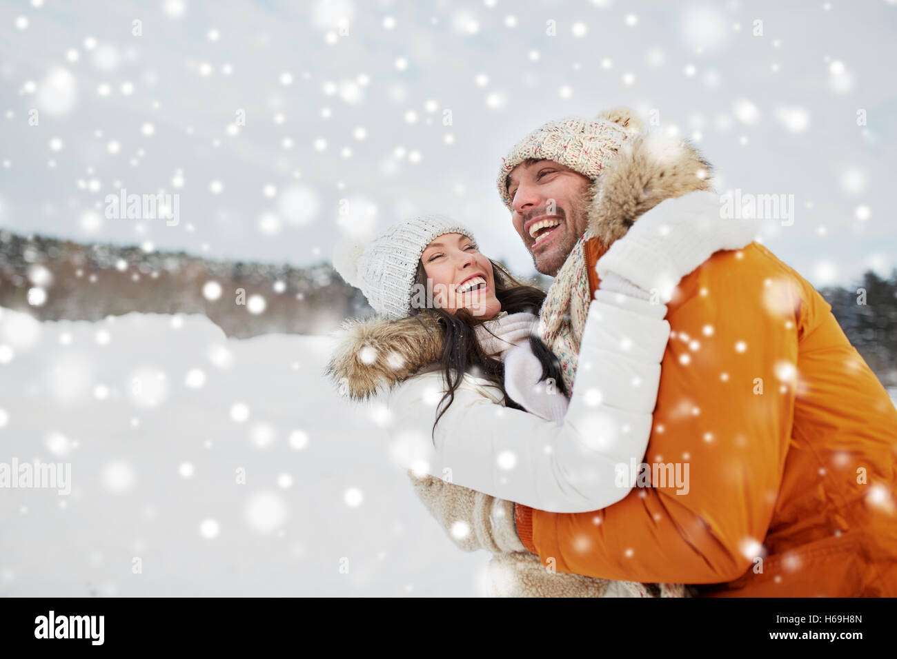 happy couple hugging outdoors in winter Stock Photo - Alamy