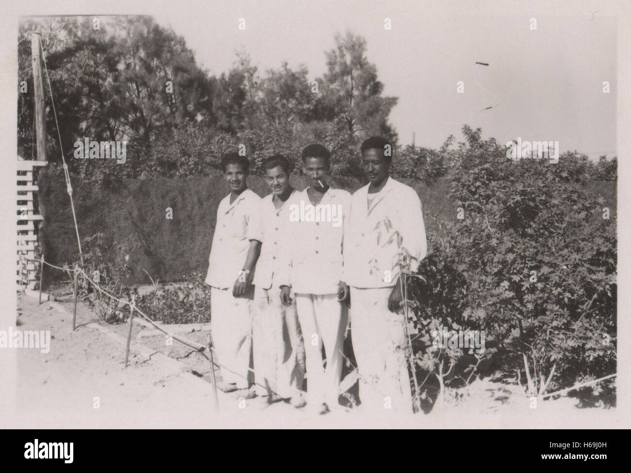 Egyptian waiters working for the British army in the Sergeants mess at 10 Base Ordnance Depot Royal Army Ordnance Corps (RAOC) camp at Geneifa Ismailia area near the Suez Canal 1952 in the period prior to withdrawal of British troops from the Suez Canal zone and the Suez Crisis Stock Photo