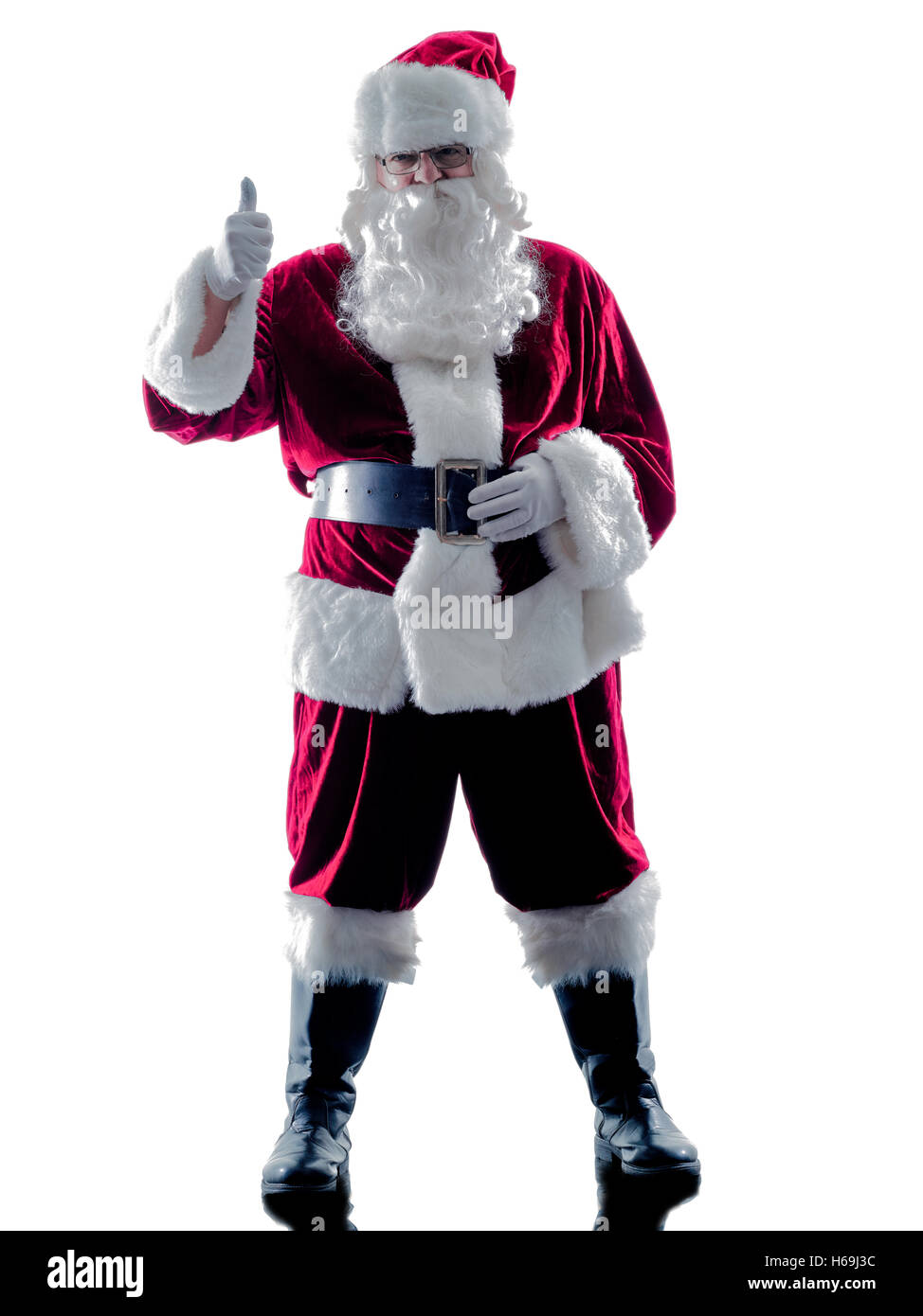 one santa claus man Thumbs Up silhouette isolated on white background Stock Photo
