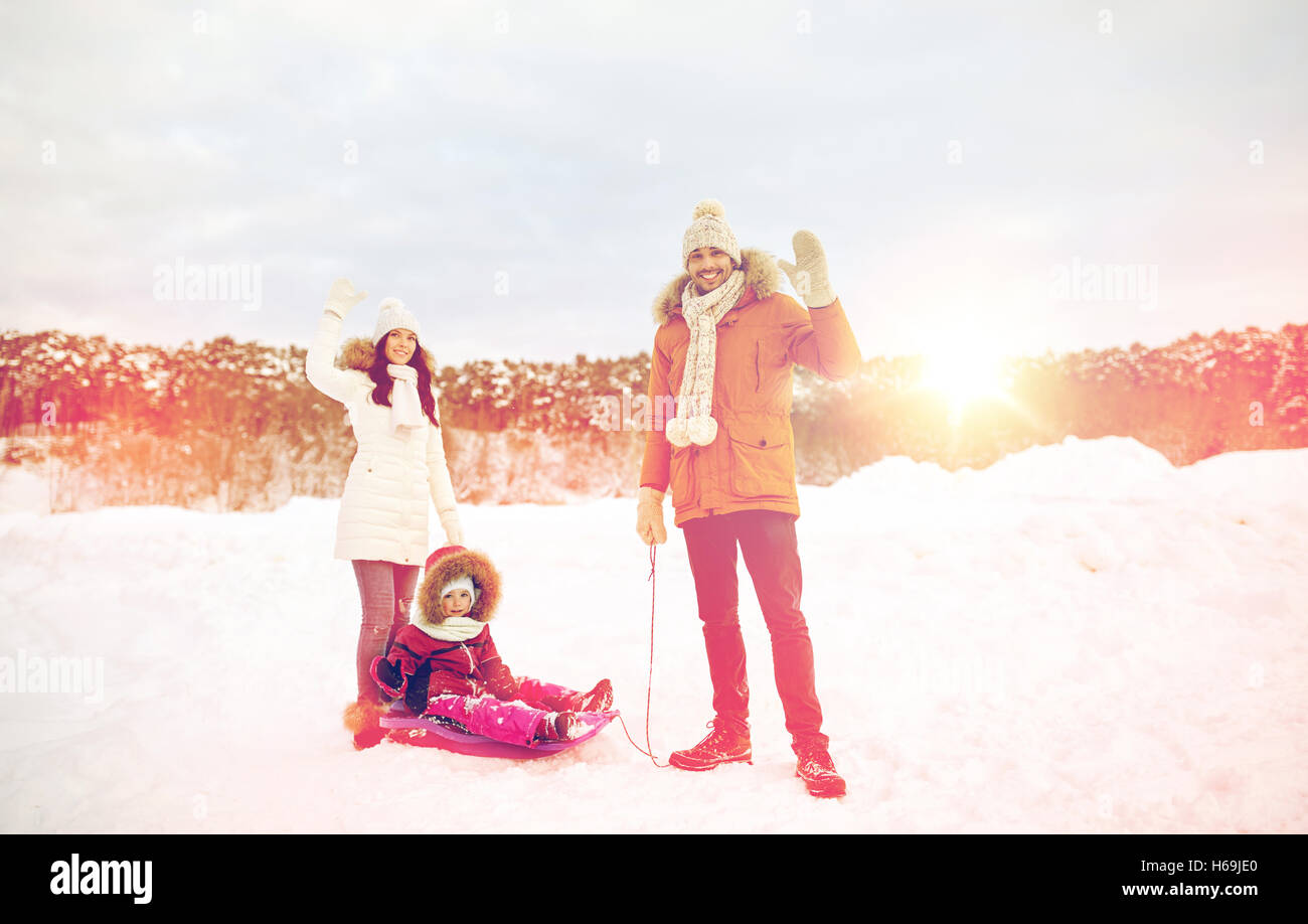 happy family with sled walking in winter outdoors Stock Photo - Alamy