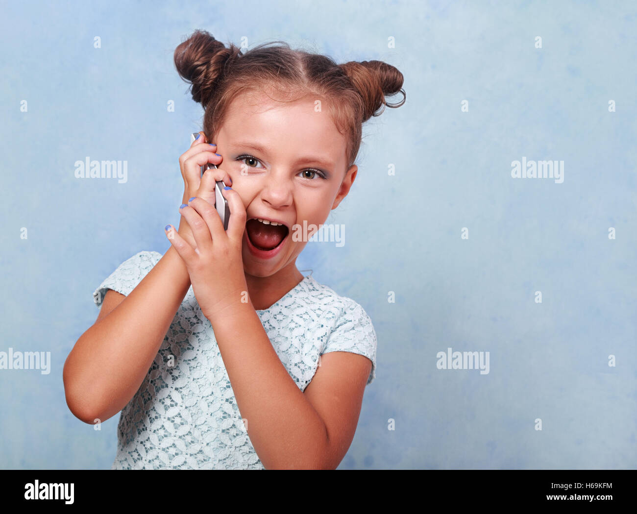 Excited kids face. Amazed expression, cheerful and glad. Amazed child with  open mouth on yellow background, surprise Stock Photo - Alamy