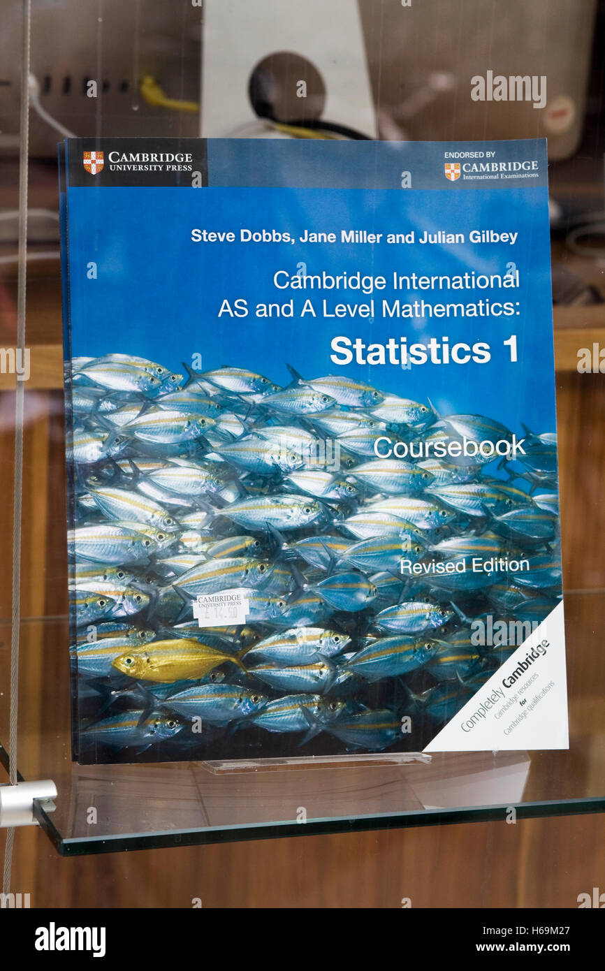 Education books in a shop window 'Cambridge international as and a level mathematics books Statistics 1' Stock Photo