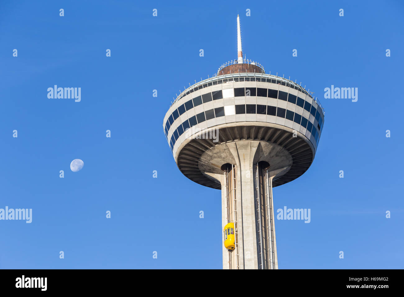 An outside elevator carries tourists to the observation deck of Skylon Tower in Niagara Falls, Ontario, Canada. Stock Photo